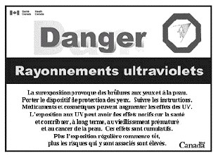 The image is the French version of the ultraviolet radiation warning label as described in section 5. The image also includes a hazard symbol in the upper right corner, which is an octagonal sign depicting the outline of a human form being irradiated by a source of ultraviolet radiation represented by lines coming from a point above and to the right of the human form. In the upper left corner is a Canadian flag with the words “Health Canada” and “Santé Canada” to its right. In the lower right corner is the word “Canada” with a Canadian flag above the last letter.