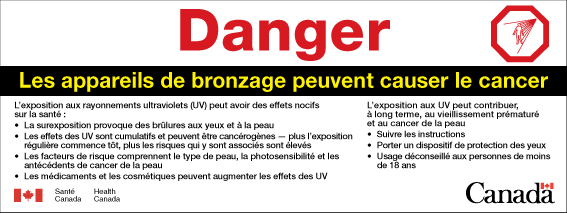 The image is the French version of the ultraviolet radiation warning label as described in section 5. The image also includes a hazard symbol in the upper right corner, which is an octagonal sign depicting the outline of a human form being irradiated by a source of ultraviolet radiation represented by lines coming from a point above and to the right of the human form. In the lower left corner is a Canadian flag with the words “Santé Canada” and “Health Canada” to its right. In the lower right corner is the word “Canada” with a Canadian flag above the last letter.